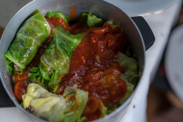 Cooking stuffed cabbage. Making minced meat in cabbage leaves.