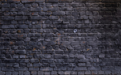 Old wall of stone bricks as a texture or background