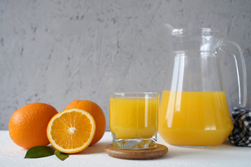 Fototapeta na wymiar fresh orange juice in glass and oranges