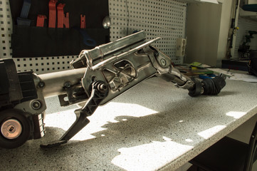 A fragment of the car steering column lies on the table, the photo at an angle.
