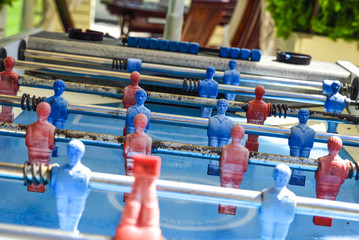 close-up of an old foosball table