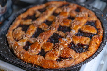 Sweet cake with jam and nuts