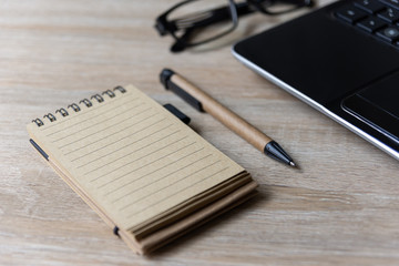 notebook and pen on the table