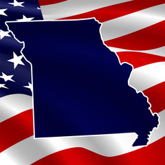 United States, Missouri. Dark blue silhouette of the state on its borders on the background of the USA flag.