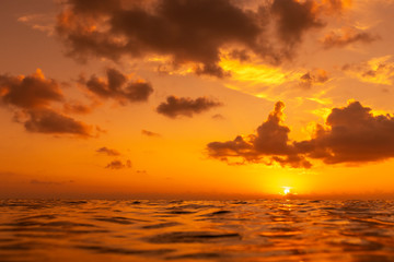 Colorful sunset over ocean surface.