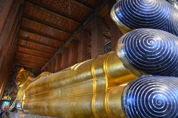Giant body of the reclining buddha at Wat Pho in Bangkok