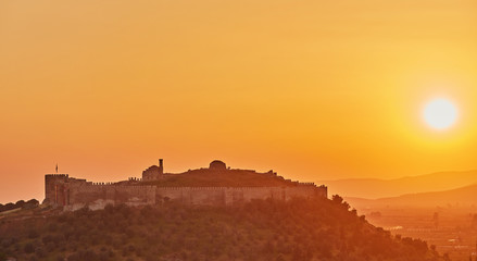 View of Selcuk with Ayasuluk fortress during sunset in the evening