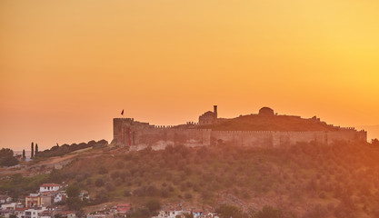 Fototapeta premium View of Selcuk with Ayasuluk fortress during sunset in the evening