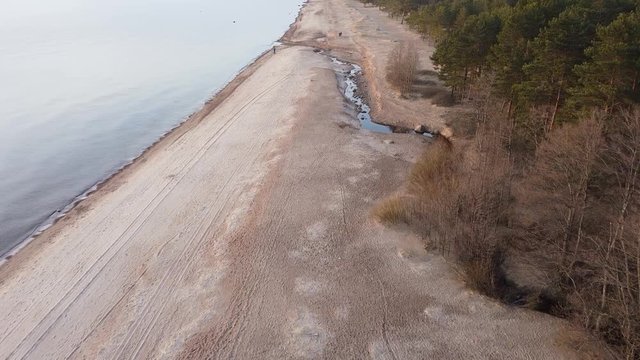 video with aerial viewof brook between forest and sea