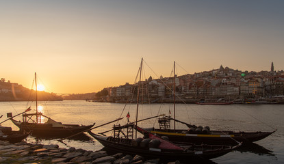 Porto cityscape in sunset with river on the front and wine carrier ship in  foreground and city of Porto in background, Portugal - 346638118