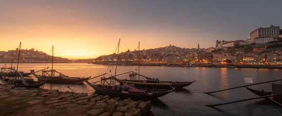 Panoramic of Porto cityscape in sunset with river on the front and wine carrier ship in  foreground and city of Porto in background, Portugal - 346638540
