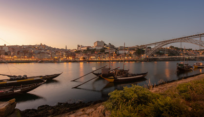 Porto cityscape in sunset with river on the front and wine carrier ship in  foreground and city of Porto in background, Portugal - 346638799