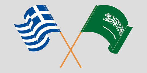 Crossed and waving flags of Greece and the Kingdom of Saudi Arabia