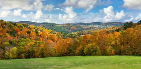 Brilliant fall colors in Vermont Countryside road and farm in Autumn near Woodstock