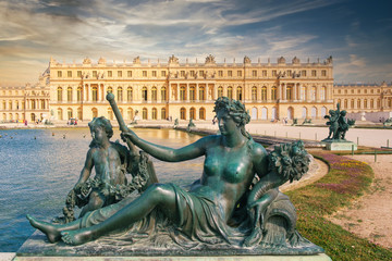 The royal Palace of Versailles near Paris at sunset