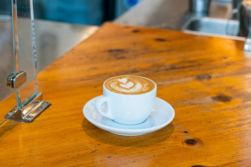 cup of coffee on wooden table