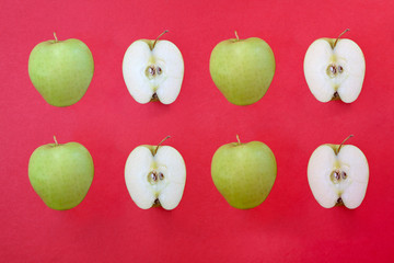 Half sliced apple pattern in red background