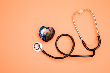Stethoscope with globe on a red background.Headline