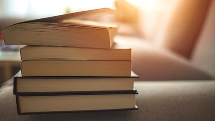 Composition with stack of books. Stack and pile of books on table in public or school library....