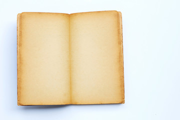 Opened old book isolated on white background.