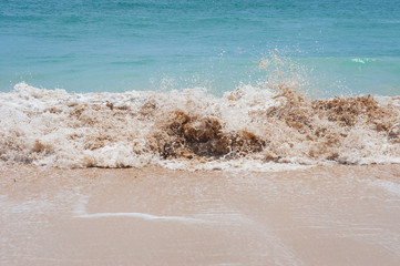 Ocean waves on a sandy beach.