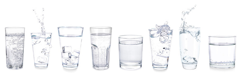 Many glasses of fresh water on white background