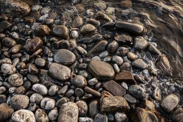 abstract background of wet stones on the beach