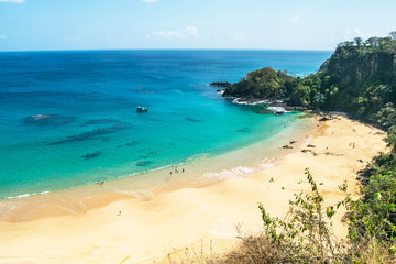 Panoramic view of Sancho Beach and Sancho bay, Fernando de Noronha Island, Brazil. Natural beach with trees and plants around