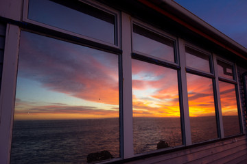 sunset over the sea
window