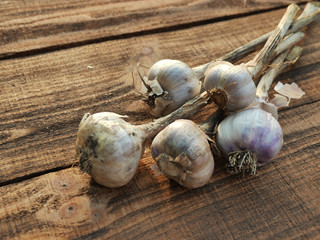 Organic garlic on wooden background. Immunity improves Vegetables