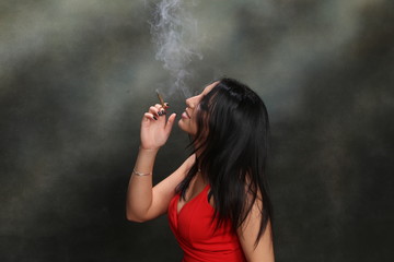 Beautiful, fancy glamourous caucasian girl with black hair posing in studio. Style, trends,...