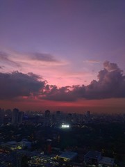 time lapse clouds over the city at night