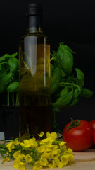 
composition of vegetables, mushrooms, oil, basil, tomatoes