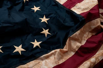 Revolutionary war, patriotism and birth of the United Sates of America concept with closeup on the original 13 star American flag known as the Betsy Ross © Victor Moussa