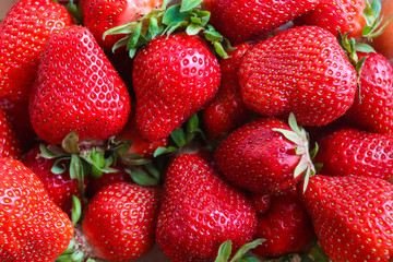 Fresh strawberries background. Top view. Fresh, organic fruits. Healthy food concept. Flat lay, macro
