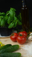 
composition of vegetables, mushrooms, oil, basil, tomatoes