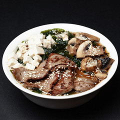 miso soup with meat on a black background, menu