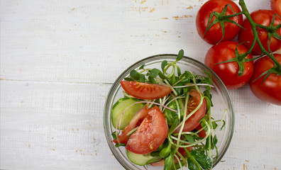 Fresh salad with cucumbers and tomatoes, sprouted seed sprouts. Healthy eating concept. view from above. copyspace
