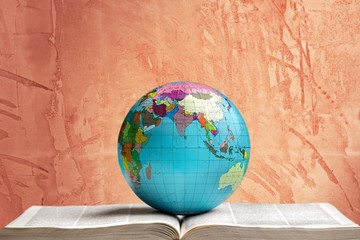School stationery composition. globe on book