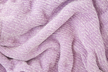 Fototapeta na wymiar Lilac fabric with large knitted fibers closeup background