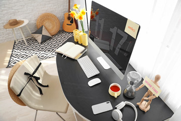 Modern workplace with computer in room