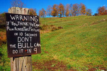 A humorous sign warns potential tresspassrs to stay off the property