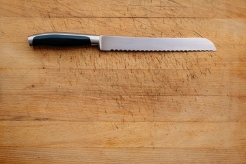 Bread knife on a wooden cutting board