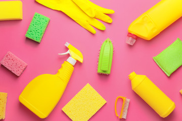 Set of cleaning supplies on color background