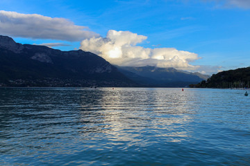 The Iles des Cygnes at sunset, a famous artificial island on Lake Annecy (Lac d'Annecy) with the French Alps in the background, Annecy, Haute-Savoie, France.