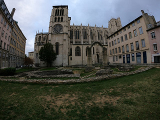 Fototapeta na wymiar The Lyon Cathedral (Cathedrale Saint-Jean-Baptiste de Lyon) and the remnants of a 5th-century cathedral and its baptismal font (Jardin Archéologique), France.