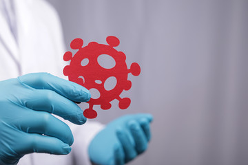 doctor with a virus in the hand immunization concept. Flu vaccine.