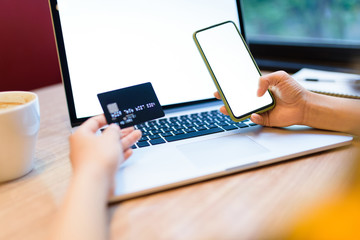 Paying online with credit card and smart phone.