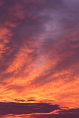Fototapeta na wymiar Dramatic sunrise, sunset pink violet orange sky with clouds background texture 