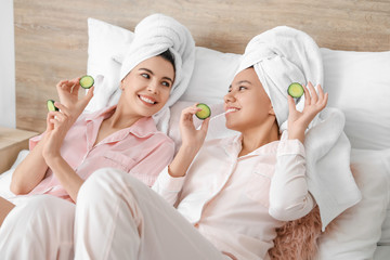 Beautiful young women taking care of their skin at home